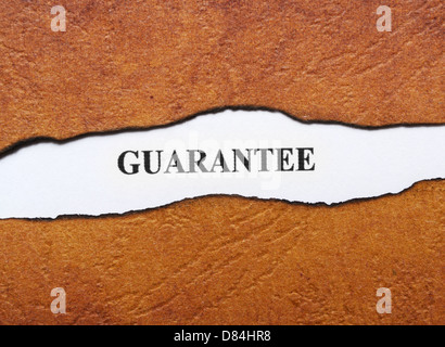 Guarantee text on paper hole Stock Photo