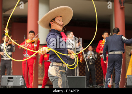 Mexican Mariachi Gaucho performing with lasso in Centennial Square at Africa Fest-Victoria, British Columbia, Canada. Stock Photo