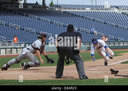 Luke Voit #30 of the Missouri State Bears follows through his swing after  making contact on a pitch during a game against the Wichita State Shockers  at Hammons Field on May 5