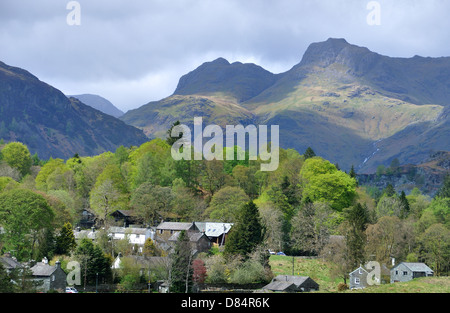 The Langdale Pikes with Elterwater in the foreground, early spring. Stock Photo