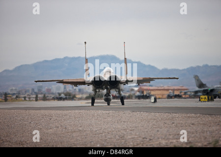 A McDonnell Douglas F-15C Eagle of the 57th Adversary Tactics Group, taxis to the runway at Nellis Air Force Base, Nevada. Stock Photo