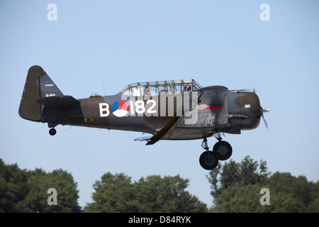 A T-6 Harvard Trainer of the Dutch Air Force historic flight team, in flight over Belgium. Stock Photo