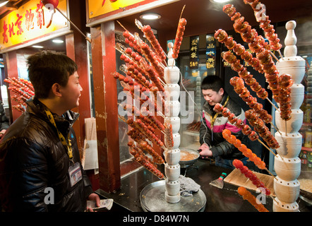 candied fruits (Tanghulu) food stall at Wangfujing Snack Street in Dongcheng District, Beijing, China Stock Photo