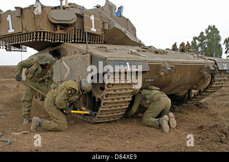 An Israel Defense Force Merkava Mark IV main battle tank during track replacement drill. Stock Photo