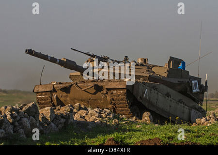 An Israel Defense Force Merkava Mark IV main battle tank during an exercise in the Golan Heights. Stock Photo