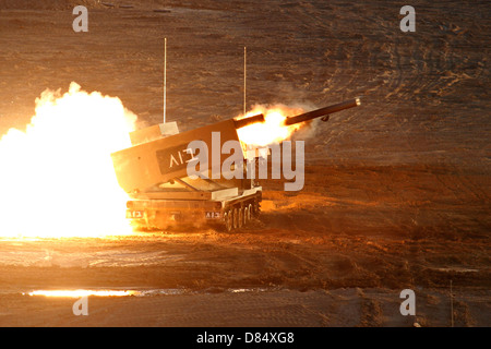 An Israel Defense Force Artillery Core MLRS launches one of its rockets during live fire exercise in the Negev desert. Stock Photo