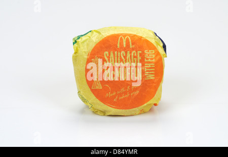 McDonald's Egg Sausage  McMuffin breakfast sandwich in paper wrapper on white background, cutout. USA Stock Photo