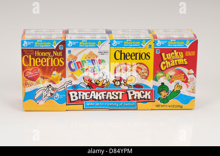 Breakfast pack of boxes of General Mills cereals of cheerios lucky charms and cinnamon toast on white background cutout. USA Stock Photo