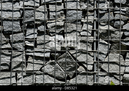 Stacked stones fenced as wall Stock Photo