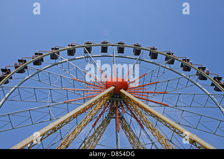 ferris wheel over blue sky Stock Photo