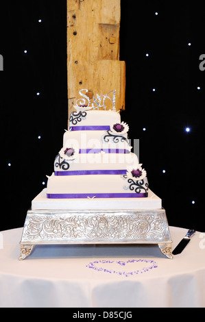 White and purple wedding cake with flower details Stock Photo