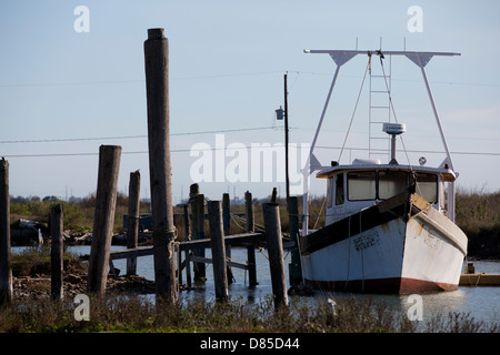 Old rusty shrimp boat tied to a pier in Galveston, Texas Stock Photo