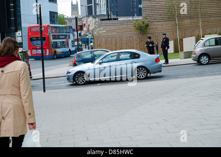 Traffic Wardens issuing parking ticket. Stock Photo