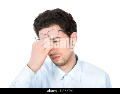 Handsome young businessman showing tired or headache gesture. Isolated on white background. Stock Photo