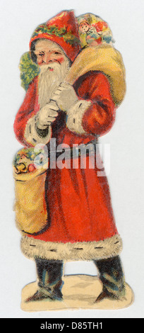 Father Christmas delivering Xmas presents Stock Photo