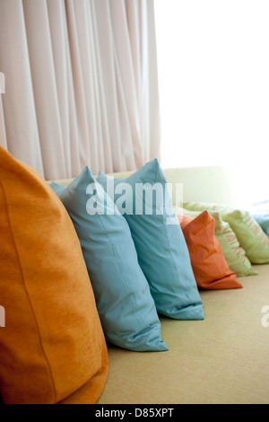 Hold pillow on the long sofa in Phuket hotel,Thailand Stock Photo