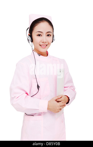 The young female nurse wearing headset Stock Photo