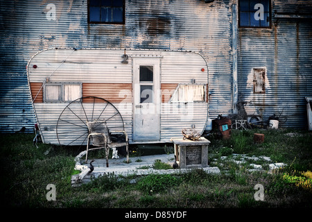 Old caravan in front of an industrial building on the hopson plantage (now shack up inn) in clarksdale missippi, usa Stock Photo