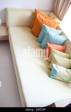 Hold pillow on the long sofa Stock Photo