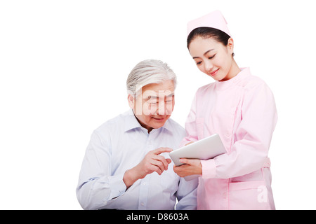 Nurses guide patients to use IPAD Stock Photo