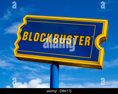 Blockbuster sign ahowing blue and yellow logo outside DVD Blu Ray and games rental outlet in the UK Stock Photo