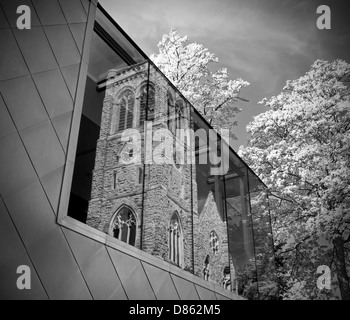 Reflection of St Faiths Church in Brenchley Gardens Maidstone Kent.  The window is part of the Maidstone Museum Extension.  B&W Stock Photo