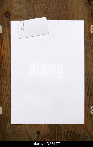 Blank white paper and business card clipped a paperclip Stock Photo