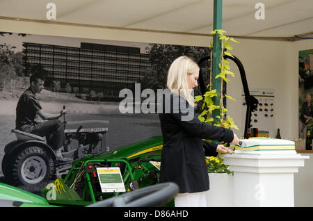 Zara Phillips cuts the cake to celebrate 50 years of John Deere at RHS Chelsea Flower Show, London, UK on Press day 20th May 2013. John Deere began producing lawnmowers and garden tractors in 1963. Stock Photo