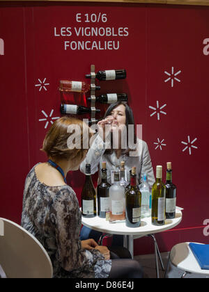 London, UK. 20th May, 2013. Visitors tasting wine at the London Wine Fair 2013 Credit: Julio Etchart/Alamy Live News Stock Photo