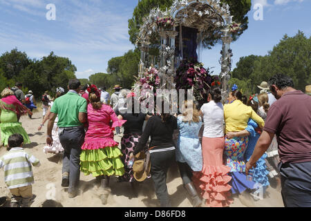 May 16, 2013 - El Rocio, Andalusia, Spain - The El Rocio Pilgrimage dates back to 1653 and attracts more than a million Catholic pilgrims from all over Spain to the small shrine of El Rocio in the province of Huelva in Andalucia. The pilgrims, known as Rocieros, travel in groups called brotherhoods and arrive on foot or with horses, wagons and elaborate horse-drawn carriages designed to transport the silver and gold Madonnas to the shrine. Pictured is the brotherhood of Jerez traveling through the sands of the DonaÃ±a National park on a 55 mile journey to reach El Rocio. From there, in the ear Stock Photo
