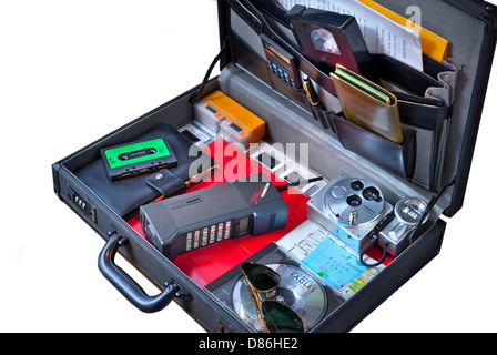 1980's business briefcase & contents including  Cityman Mobira first generation mobile phone,VHS cassette, Eagles CD ,35mm film camera, Filofax etc... Stock Photo