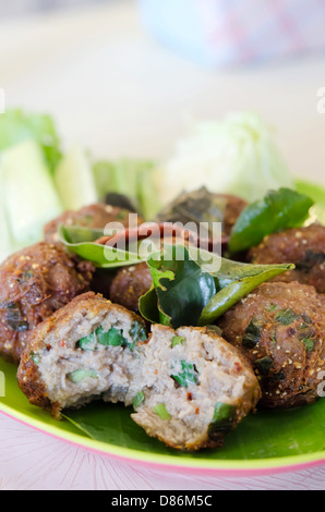 meatballs served with fried bergamot leaves and fresh vegetable Stock Photo