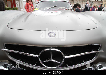 A vintage 1955 Mercedes-Benz 300 SL competes in the 1000 mile Mille Miglia round trip from Brescia to Rome and back again. Stock Photo