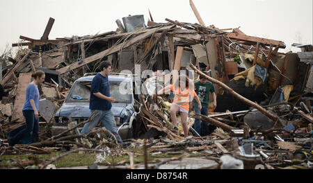 Moore, Oklahoma, USA. 20th May 2013.Destroyed buildings and overturned cars are seen after a huge tornado struck Moore.  A huge tornado with winds of up to 200 miles per hour (320 kph) devastated the Oklahoma City suburb of Moore on Monday, ripping up at least two elementary schools and a hospital and leaving a wake of tangled wreckage. At least 91people were killed, KFOR television said, citing a reporter's eyewitness account, and hospitals said dozens of people were injured Credit:  ZUMA Press, Inc. / Alamy Live News Stock Photo