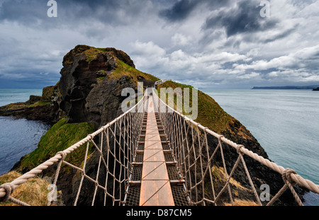 Vertigo inducing view  on  Carrick-a-Rede rope bridge. Stock Photo