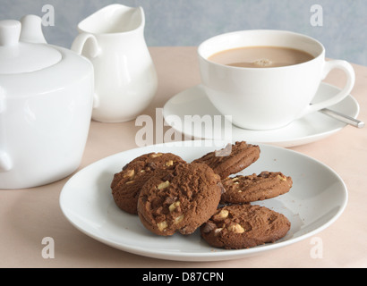 A cup of tea and chocolate biscuits. Stock Photo