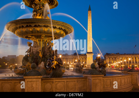 Twilight at Fontaine des Mers - Fountain of the Seas in Place de la Concorde, Paris France Stock Photo