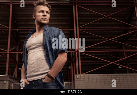 Man standing in front iron framework Stock Photo