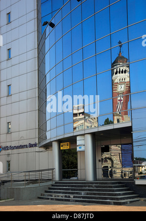 Orthodox Cathedral, St. Joan Botezatorul reflected in PETROM-building, Ploiesti, a town in the Great Wallachia, Romania Stock Photo