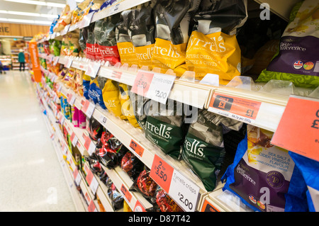 Crisps aisle in a Sainsburys supermarket, UK Stock Photo