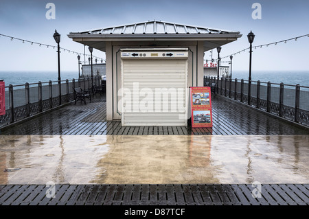 Closed shops on Paignton Pier on a rainy day in late Spring, Devon, UK Stock Photo