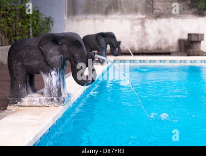 Elephant shaped fountains at the pool Stock Photo