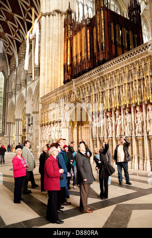 York Minster cathedral - tourists on a guided tour of the interior, Yorkshire UK Stock Photo