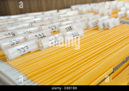 Yellow file cabinet on a hotel reception Stock Photo