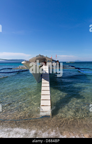 Typical Ferry Boat on the Big La Laguna Beach on Mindoro Island, Philippines Stock Photo