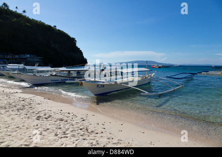 Typical Ferry Boat on the Big La Laguna Beach on Mindoro Island, Philippines Stock Photo