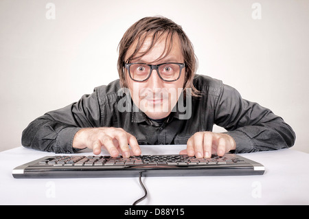 Hacker in Action on the keyboard Stock Photo