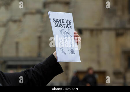 London, UK. 22nd May 2013. Members of the legal profession including barristers and legal aid lawyers stage a protest outside Parliament in Westminster against proposed government changes and cuts to legal aid.   Credit: Amer Ghazzal/Alamy Live News Stock Photo