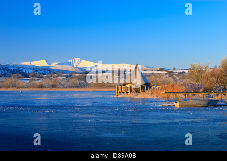 Llangorse Lake Brecon Beacons Powys Wales in winter with Pen y Fan & Corn Du mountains Stock Photo