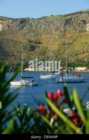 CROATIA. Boats in Zaton Bay near Dubrovnik, with the village of Zaton Mali in the distance. 2010. Stock Photo